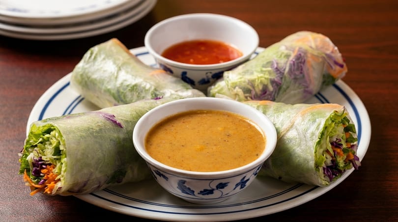 Four fresh spring rolls filled with vegetables, served with peanut and chili dipping sauces.